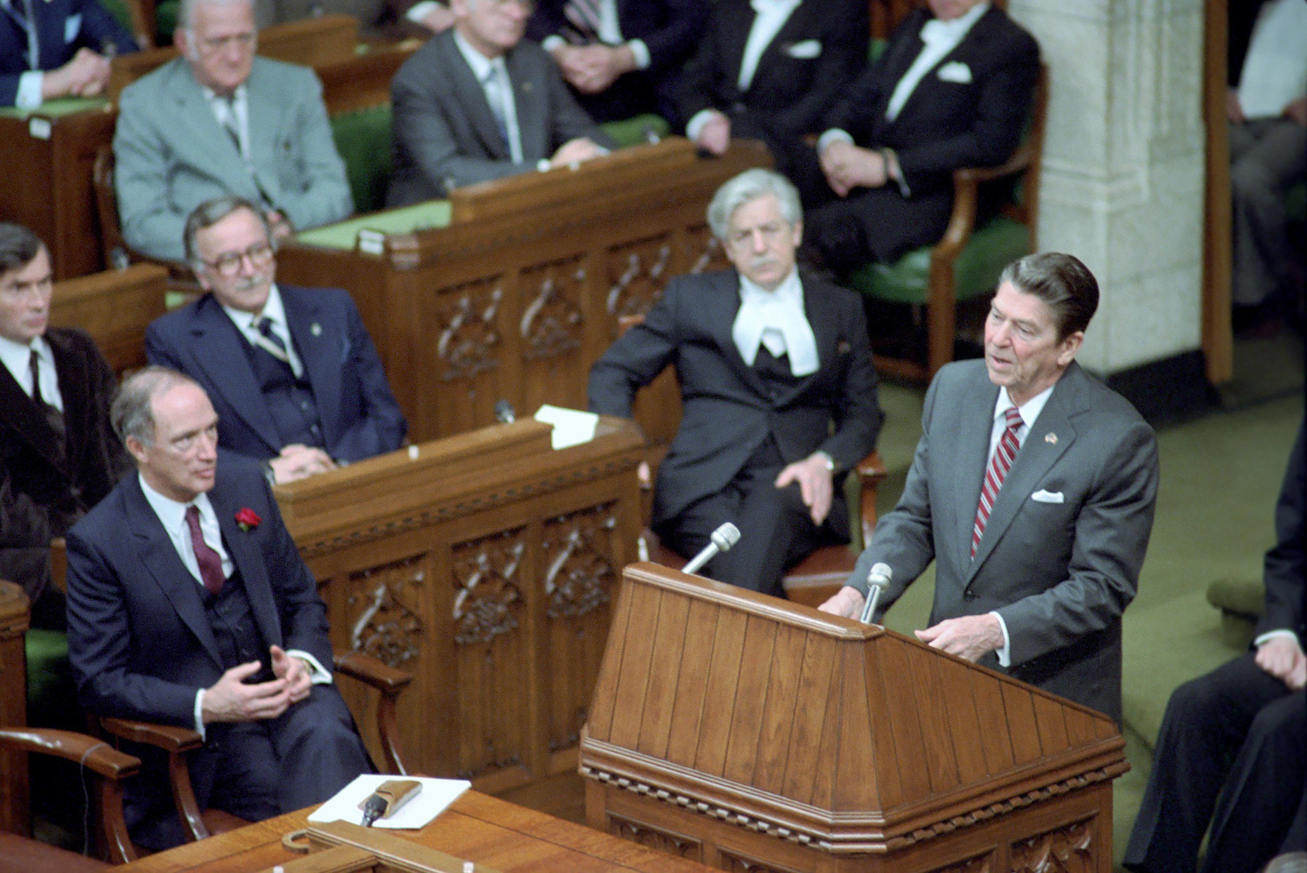 President_Ronald_Reagan_speaking_at_podium_while_addressing_members_of_the_House_of_Commons_during_trip_to_Canada
